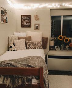 a bedroom with white walls and lights on the ceiling