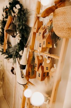 a ladder decorated with wooden houses and lights