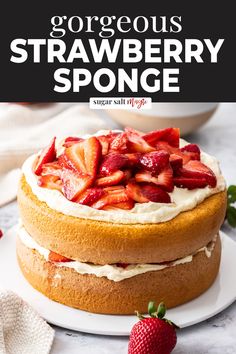 a strawberry sponge cake on a plate with strawberries