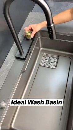 a stainless steel sink with an overflowing faucet on the side and drain