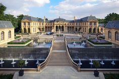 an artist's rendering of a large mansion with fountains