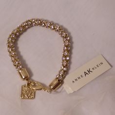 Clear Rhinestones Flex Bracelet By Anne Klein Ak. Measurements 7 Inches Long. Lobster Clasp And Lion And Anne Klein Etched With Clear Rhinestone Dangle. Measurements Done Laying Down Are Estimated. Does Not Fit X- Large Wrists, Otherwise Could Add Attachments To Make Longer. New With Tags. Stock # M- 17* Crystal Bracelet With Rhinestones And Cubic Zirconia, Adjustable Bling Crystal Bracelet, Jeweled Crystal Costume Bracelet, Expensive Jewelry Luxury, Vintage Makeup, Expensive Jewelry, Rhinestone Bracelet, Anne Klein, Clear Rhinestones