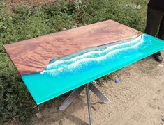 a table that has been made to look like an ocean scene with waves on it