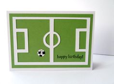 a green birthday card with a soccer field