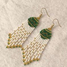 Gorgeous Christmas ornaments dangling from your ears! Sparkling beads & fun fringe! Green, Gold, & Pearly White beads! -handmade  -about 3.5in length -18k gold plated hooks Seed Bead Christmas Earrings, Christmas Fringe Earrings, Festive Green Beaded Drop Earrings, Green Beaded Earrings, Green Beaded Earrings For Christmas, Festive Green Earrings With Colorful Beads, Festive Green Beaded Earrings, Festive Green Dangling Beads Earrings, Seed Bead Crafts