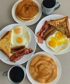 breakfast plates with eggs, bacon, pancakes and coffee