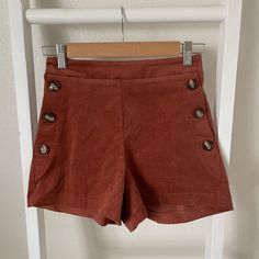 ***Boutique Brand*** Nwt These Shorts Are So Boho And Stylish! Pair With Your Favorite Boho Hat And Booties For A Super Cute Look! ~~~~~ -Size Small -True To Size -Stretchy Waist Band -Button Details On Pockets -Pockets Not Functional -Corduroy Feel -Super Comfortable ~~~~~ 100% Cotton #35 Chic Brown Button-up Bottoms, Trendy Fall Shorts With Button Closure, Brown Corduroy Bottoms With Buttons, Trendy Workwear Shorts With Buttons, High Waist Brown Corduroy Shorts, Brown High Waist Corduroy Shorts, Brown High-waisted Corduroy Shorts, Fall Bottoms With Buttons And Short Length, Fall Bottoms With Buttons In Short Length