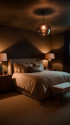 a large bed sitting in a bedroom next to two lamps on either side of it