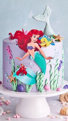 the little mermaid cake is decorated with fondant