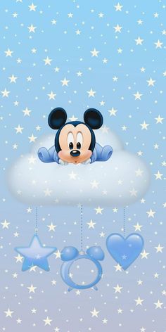 a mickey mouse hanging from the side of a cloud with stars in the sky behind it