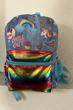 nickelodean  girl's backpack Colorful Large front pocket Adjustable strap Mesh pockets on both sides Condition is great Measurement - height 16" width 12" depth 5" Rainbow-colored Standard Backpack For School, Casual Rainbow School Bag, Rainbow School Backpack, Rainbow Colored School Backpack, Rainbow Standard School Backpack, Fun Multicolor Backpack For Back To School, Cute Rainbow School Bag, Cute Rainbow School Bags, Playful Rainbow School Bag