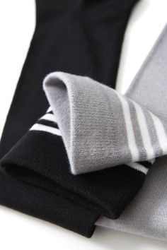 Plushell Elegance Knee High Bamboo Viscose Socks, where fashion meets functionality and your legs take center stage. These versatile and stylish socks are designed to add a touch of elegance and flair to any outfit. Crafted from premium bamboo viscose fibers, these knee-high socks offer a luxurious and eco-conscious option for those seeking both fashion and comfort. Color: Black with white stripes Length: Knee-High Thickness Scale: Airy Composition: 65.8% bamboo viscose +31.6% polyester+2.6% ela Elegant Black Knee-high Socks, Trendy Black Fall Hosiery, Black Footless Tights For Winter, Elegant Black Thigh High Socks, Black Stretch Winter Socks, Winter Stretch Black Stockings, Trendy Black Stretch Knee-high Socks, Black Stretch Stockings For Winter, Black One Size Socks For Fall