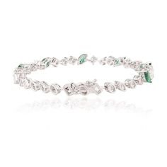 This is part of Chairish’s Fine Jewelry assortment.  This Magnificent Emerald and Diamond Tennis Bracelet in 18K gold showcases endlessly sparkling natural emerald, weighing 2.17 carat and diamonds weighing 2.16 carats. It measures 7 inches long in length.  Emerald enhances intellectual capacity of the person. Designed with perfect marquise cut emerald set with different cut diamonds after each emerald to make you stand out on any occasion or event. The elegant style complements the attire beaut Wedding Emerald Diamond Bracelet, Emerald Diamond Bracelet For Wedding, Fine Jewelry Emerald Diamond Bracelet For Wedding, Fine Jewelry Emerald Bracelet With Brilliant Cut, Luxury Elegant Tennis Bracelet With Emerald, Elegant White Gold Tennis Bracelet With Emeralds, Elegant White Gold Diamond Bracelet With Emerald, Elegant White Gold Emerald Tennis Bracelet, Luxury Emerald Tennis Bracelet Fine Jewelry