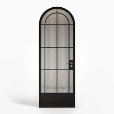 an arched glass door with black frame and metal bars on the bottom, against a white background