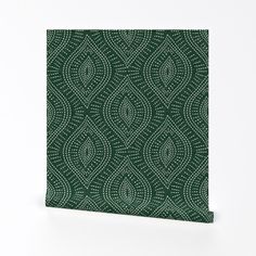 a green and white wallpaper with an intricate design on it's side, in front of a white background