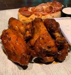 some chicken wings are sitting on a table