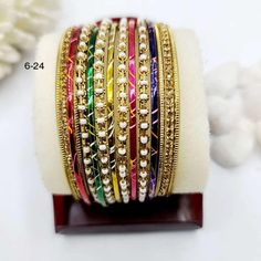 Unlock the beauty within, let these elegant Multicolored bangles tell your story. Elegant Multicolor Festive Bracelets, Elegant Multicolor Hand Set Bridal Sets, Elegant Multicolor Bridal Sets For Festive Occasions, Multicolor Jewelry For Marriage And Festivals, Multicolor Hand Set Bracelet, Multicolor Festive Bracelet Jewelry, Elegant Multicolor Bridal Sets For Festivals, Multicolor Bangle For Festive Occasions, Traditional Multicolor Bracelets For Marriage