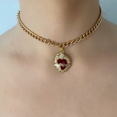 Are you looking for the perfect necklace for this fall season? My red and gold sacred heart choker necklace is a unique piece of handmade jewelry to wear and to gift! Inspired by my love for sacred heart jewelry and unique anniversary gift ideas, my thick gold chain choker necklace is the perfect compliment to any outfit idea. My red heart choker is a great gift idea for any special occasion to all the women in your life! You can't go wrong when gifting my Mexican heart necklace to your mother, Vintage Choker Jewelry For Valentine's Day, Vintage Valentine's Day Choker, Vintage Heart Charm Choker Jewelry, Vintage Heart Charm Choker, Valentine's Day Gift Choker With Clavicle Chain, Valentine's Day Gift Clavicle Chain Choker, Valentine's Day Heart Pendant Choker With Clavicle Chain, Valentine's Day Heart Pendant Clavicle Chain Choker, Valentine's Day Gift Charm Choker Necklaces