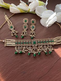 Elegant Indian Necklace Gold Plating. Indian Bridal traditional One Gram Jewelry Choker Set. Gorgeous 24 K gold plated. Beautiful and elegant Kundan and Meenakari Green beads choker. Perfect for Indian weddings. Size- Adjustable Premium Quality and High craftsmanship Gorgeous 24 K gold plated. All the raw material used in this product is of high quality and is handcrafted with love. Premium Quality and High craftsmanship 100% Satisfaction Guarantee: Long Lasting Plating, High-Quality Stones. Gif Bollywood Chandbali Choker With Zari Work, Kundan Chandbali Choker With Intricate Design, Temple Jewelry Kundan Choker For Reception, Festive Stone Work Choker For Reception, Kundan Choker With Zari Work In Chandbali Shape, Kundan Choker With Chandbali Zari Work, Kundan Choker With Meenakari For Reception, Kundan Choker For Wedding And Eid, Wedding Chandbali Choker With Zari Work