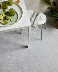 A table with green juice, kiwis, lemons and glasses on a grey carpet (Starlight from the Riva range) Carpet Samples, Soft Focus, Easy Clean, Summer Days, The Colour, Peace Of Mind, Easy Cleaning, Bleach, The Light