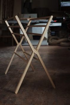 a wooden chair sitting on top of a hard wood floor