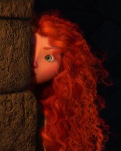 a red haired doll with long hair peeking out from behind a brick wall in the dark