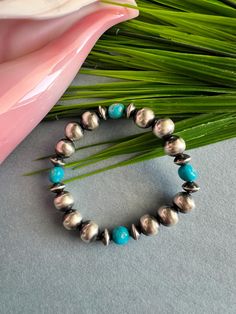 Navajo Pearls are 10mm round and 8mm saucers.  Sleeping Beauty Turquoise nuggets.  The bracelet is stretchy elastic, easy to wear on.  You will receive the exact item in the photo.  Thanks for looking and check out more items in my Etsy shop for more great items and deals! https://www.etsy.com/shop/925usa Payment: We accept all major credit cards through direct check out and Paypal. New Mexico residents have to pay sales tax. Payments must be made within 3 days of purchase or the purchase will b Navajo Pearls, Sleeping Beauty Turquoise, Sales Tax, Stretch Bracelet, Stretch Bracelets, New Mexico, Credit Cards, Arm Band, Sleeping Beauty