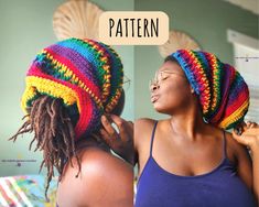 a woman wearing a multicolored crochet hat with dreadlocks on her head