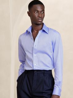 Designed for ease of wear and care, this sleek dress shirt employs a special cotton fabric with PUREPRESS™ cotton technology, a special process that smooths and protects the fabric, resulting in a wrinkle-resistant finish.  Slim fit with darts at the back.  Spread collar.  Shirttail hem.  Slim fit.  Long sleeves.  Hip length.  Model: Size M, 6'2" (188cm). Sleek Dress, Smart Dress, Blue Texture, Glen Plaid, Men Shirt Style, The Gap, Hip Length, Dress Shirt, Black And Navy