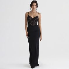 Features: Expertly crafted with elegant lace and showcasing a sleek spaghetti strap design, this black bodycon maxi dress is perfect for making a statement at a club party. The sleeveless and backless style exudes confidence and sexiness, while the figure-hugging fit highlights your curves. Indulge in the ultimate combination of style and comfort. Chic Fitted Maxi Dress With Lace Bodice, Elegant Maxi Dress With Lace Back And Spaghetti Straps, Elegant Spaghetti Strap Maxi Dress For Date Night, Fitted Lace Maxi Dress For Night Out, Floor-length Lace Trim Maxi Dress For Night Out, Lace Maxi Dress With Spaghetti Straps For Evening, Lace Maxi Dress With Spaghetti Straps For Prom, Evening Maxi Dress With Spaghetti Straps And Lace, Evening Lace Maxi Dress With Spaghetti Straps