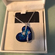 Silver And Blue Heart Pendant With Shooting Stars, Inscription On The Back Reads “You To The Moon And Back” Blue Star Shaped Necklace For Gift, Moon Pendant Necklace, Shooting Stars, Blue Heart, Moon Pendant, Heart Pendant Necklace, Heart Necklace, Blue And Silver, Heart Pendant