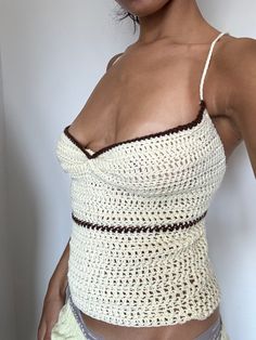 Lovely vintage handmade crochet cami top, cream with a brown trim & a ruched front. Cute for a casual outfit to go get a coffee or hang with friends! So cute paired with some low rise jeans and boots🫶🏽 Would fit an 8-10. FREE UK DELIVERY📍 Cream Crochet Top, Fitted Crochet Trim Cami Top, Fitted Beige Crochet Top, Fitted Cream Crochet Tops, Fitted Brown Crochet Top For Spring, Beige Fitted Crochet Cotton Top, Fitted Cream Crochet Top For Summer, Fitted Beige Cotton Crochet Top, Brown Cotton Crochet Top For Spring