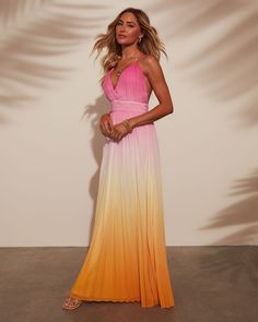 Where sunset hues meets effortless style, the Cora Ombre Maxi Dress was designed. Crafted from a pleated lightweight fabric, it flows gracefully with every step. The crisscross back straps add a touch of allure, perfect for warm evenings and beachside escapes. Embrace relaxed sophistication with this timeless piece that effortlessly transitions from day to night. V neckline Pleated lightweight fabric Adjustable crisscross back straps Hidden back zipper closure Lined 100% polyester Runs Large Summer Evening Dresses With Cross Back, Summer Evening Dress With Cross Back, Summer Evening Ombre Maxi Dress, Elegant Ombre Maxi Dress For Summer, Pink Beach Dress With Crisscross Straps, Chic Maxi Dress With Crisscross Straps For Summer, Chic Summer Maxi Dress With Crisscross Straps, Ombre Dress For Spring Vacation, Summer Maxi Dress With Strappy Crisscross Straps