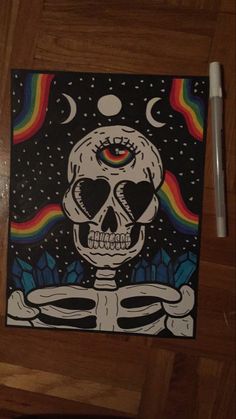 a painting of a skeleton with a rainbow in the background and a pen on top of it