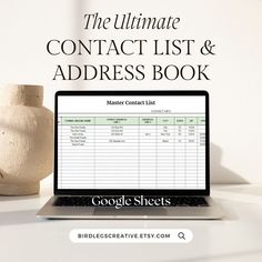 the ultimate contact list and address book on a laptop next to a vase with flowers