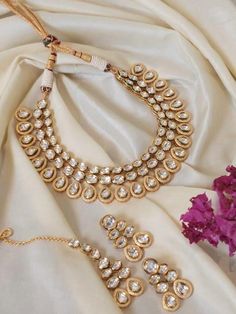 Uncut Polki wedding jewellery necklace set in gold plated with pretty earrings and a matching maang tikka Minimal, classy and chic this is a perfect choice for brides who loves statement jewelry and yet keep it chic This order will include  -A necklace -A pair of earrings -A matching maang tikka For any order related query, connect with us today Team Rosh Jewellery Indian, Indian Brides, Maang Tikka, Jewellery Necklace, Bridal Jewellery Indian, Wedding Jewellery, Wedding Jewellery Necklace, Bridal Jewellery, Pretty Earrings