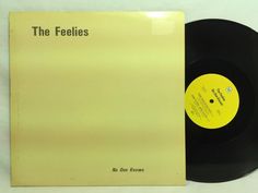 an old vinyl record with the words'the feelings'on it, sitting on a white surface