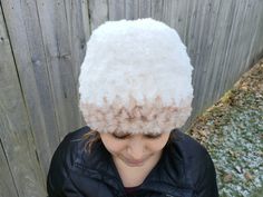 "The Plush Fur Hat is a luxurious, warm hat that really makes a statement. The hat is crocheted with super bulky weight (CYC 6) faux fur yarn and works up quickly with simple stitches in just 12 rounds. The pictured hat was made in two colors of Lion Brand Go For Faux yarn. To make it in one color, you will need two skeins of the yarn. Materials: Super bulky weight faux fur yarn: Lion Brand Go For Faux - 1 skein #098 Baked Alaska (main color); 1 skein #203 Pomeranian (second color) Size K - 6.5m White Wide Brim Crochet Hat For Winter, White Crochet Hat With Short Brim For Winter, Winter White Wide Brim Crochet Hat, White Crochet Hat With Curved Brim For Winter, Winter Flat Brim Hat One Size, Flat Brim Winter Hats One Size, Flat Brim Winter Hat, Winter Flat Brim Hat, White Beanie For Winter Costume