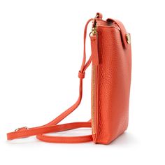 A miniature marvel of form and function, the Paris Phone Pouch holds all your necessary essentials securely in style. Made of Italian leather in a popping coral hue, it stores any sized phone in the main compartment, plus there’s also three credit card/ID pockets. Securing your phone in place with a top flap snap, this crossbody-style bag also has a side zipped section for keys and other must-haves. The Paris is perfect for a night out when a little bag goes a long way — just toss the adjustable Modern Phone Bag For Travel, Modern Travel Phone Bag, Modern Portable Phone Bag For Travel, Modern Phone Bag With Card Slots For Travel, Modern Travel Phone Bag With Card Slots, Modern Phone Bag With Cell Phone Pocket, Modern Portable Pouch Phone Bag, Modern Portable Phone Pouch Bag, Functional Business Phone Bag With Cell Phone Pocket