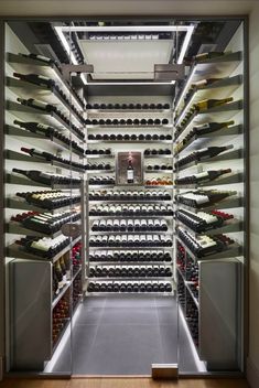 the wine cellar is filled with many bottles