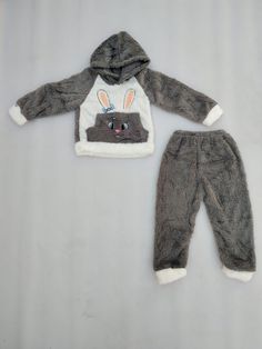 Elevate your child's winter wardrobe with our cozy and warm kids' woolen clothing set. This set includes a soft, woolen top and matching bottoms, designed to keep your little one snug and stylish throughout the chilly season. Crafted from premium quality wool, this clothing set provides excellent insulation while remaining gentle on your child's skin. Whether it's a snow day adventure or a family gathering, our woolen set ensures your child stays comfortably bundled up. Available in a variety of classic colors and patterns, this set is the perfect choice to keep your little one both toasty and trendy during the winter months. Cozy Playtime Sets For Fall, Cozy Winter Sleepover Sets, Winter Loungewear Sets, Cute Long Sleeve Sets For Winter, Cute Long Sleeve Winter Sets, Cute Winter Cotton Sets, Cute Cotton Winter Sets, Winter Sets With Long Sleeves For Sleepover, Gray Long Sleeve Winter Set