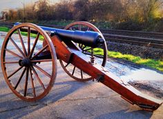 an old wooden cannon sitting on the ground