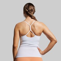 Breathability, functionality, adaptability—The Drop Shot Tank was designed to hit every mark. With a stretchy fabric that doesn’t restrict your range of motion and an ultra-flattering fit, this tank will have you hitting the perfect drop shot in next-level style. Functional Workout Tank Top With Built-in Bra, White High Stretch Racerback Top, Functional Sports Tank Top With Built-in Bra, Functional High Stretch Tank Top With Built-in Bra, White Stretch Sports Tank Top, Fitted Go-dry Tank Top For Pilates, Athletic Fit Tank Top With Built-in Bra, White Stretch Tank Top For Sports, Sporty 4-way Stretch Tank Top With Built-in Bra