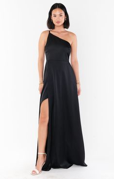 Show stopper in this sweet and structured yet flowy, maxi dress. A dainty one shoulder and a slit accent the femininity while clean lines make it a timeless silhouette. Black Bridemaids Dresses, Beachy Maxi Dress, One Shoulder Dress Black, Beige Bridesmaid Dress, Metallic Bridesmaid Dresses, Comfortable Maxi Dresses, Neutral Bridesmaid Dresses, Bridesmaid Dresses Satin, Dress With Puffy Sleeves