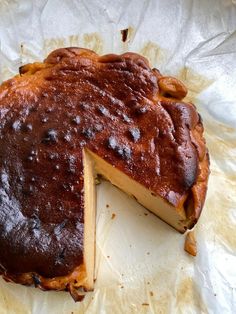 a piece of cake that has been cut in half and is sitting on some wax paper