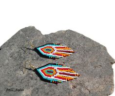 Native American Indian earrings Huichol earrings Black turquoise red Indian beaded Beaded earrings Indian jewelry Colorful earrings Short earrings American earrings Multicolored earring Fringe earrings Navajo earrings 3 inch colorful beaded earrings in American Indian style. These earrings are not authentic Native American earrings, but are made according to my author's design. I was inspired to create these earrings by the bright and colorful culture of the Indians of North and South America. C Southwestern Red Beaded Earrings As Gift, Southwestern Style Red Beaded Earrings As Gift, Southwestern Red Drop Earrings, Southwestern Style Red Beaded Earrings For Gift, Southwestern Multicolor Round Bead Earrings, Southwestern Red Earrings With Colorful Beads, Handmade Southwestern Multicolor Earrings, Red Southwestern Style Earrings With Round Beads, Southwestern Red Earrings With Dangling Beads