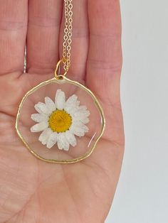 Real white dried daisy flower necklace pressed in resin.   Comes in gold or silver plated & 2 lengths, 16 inch & 18 inch Dainty White Round Flower Necklace, White Dainty Flower Necklace, White Dainty Jewelry With Pressed Flowers, Gold Necklaces With Pressed Flowers And Adjustable Fit, Dainty White Jewelry With Pressed Flowers, Handmade White Round Flower Necklace, White Birth Flower Necklace, White Resin Jewelry With Birth Flower, White Resin Birth Flower Jewelry