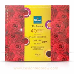 a box of tea selection with red roses on the front and yellow border around it