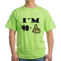 a man wearing a neon green t - shirt that says i run because really really like beer