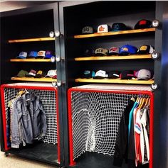 two metal lockers with hats and baseball caps on the top shelves in a room